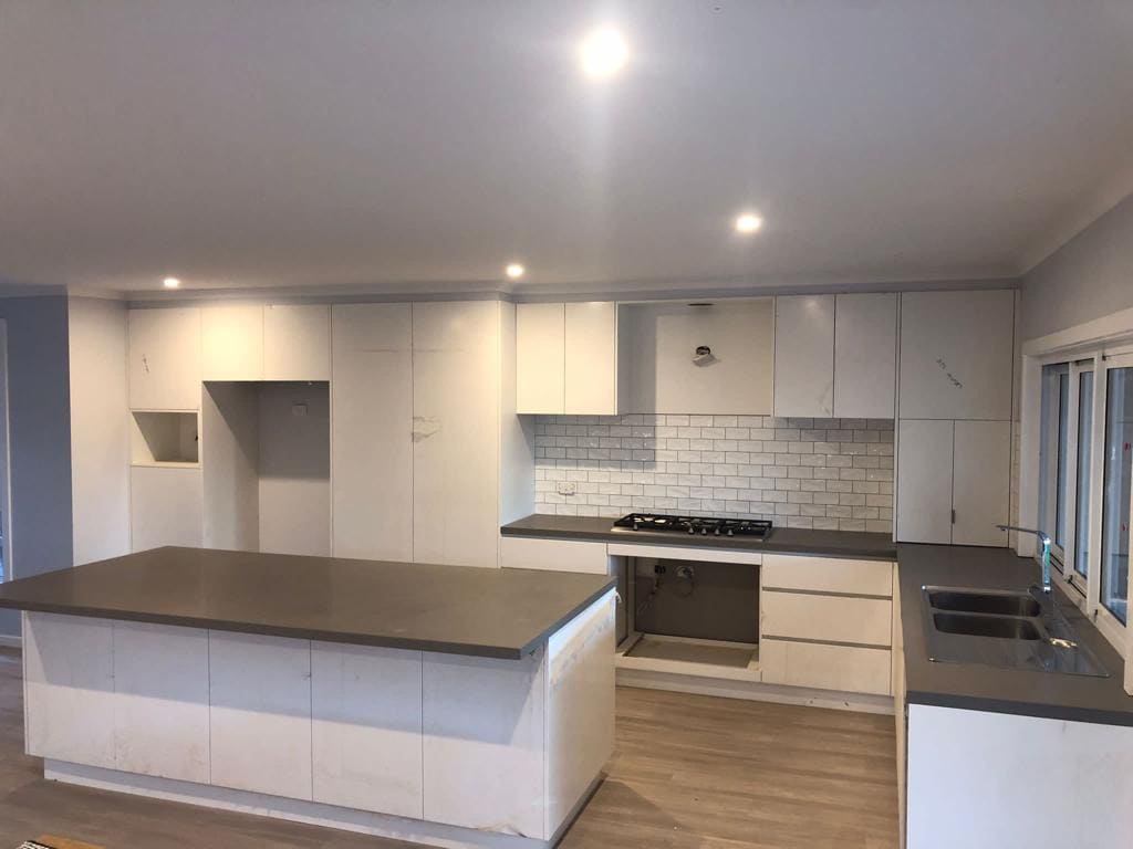 Complete Melbourne kitchen renovation with flooring and splashback