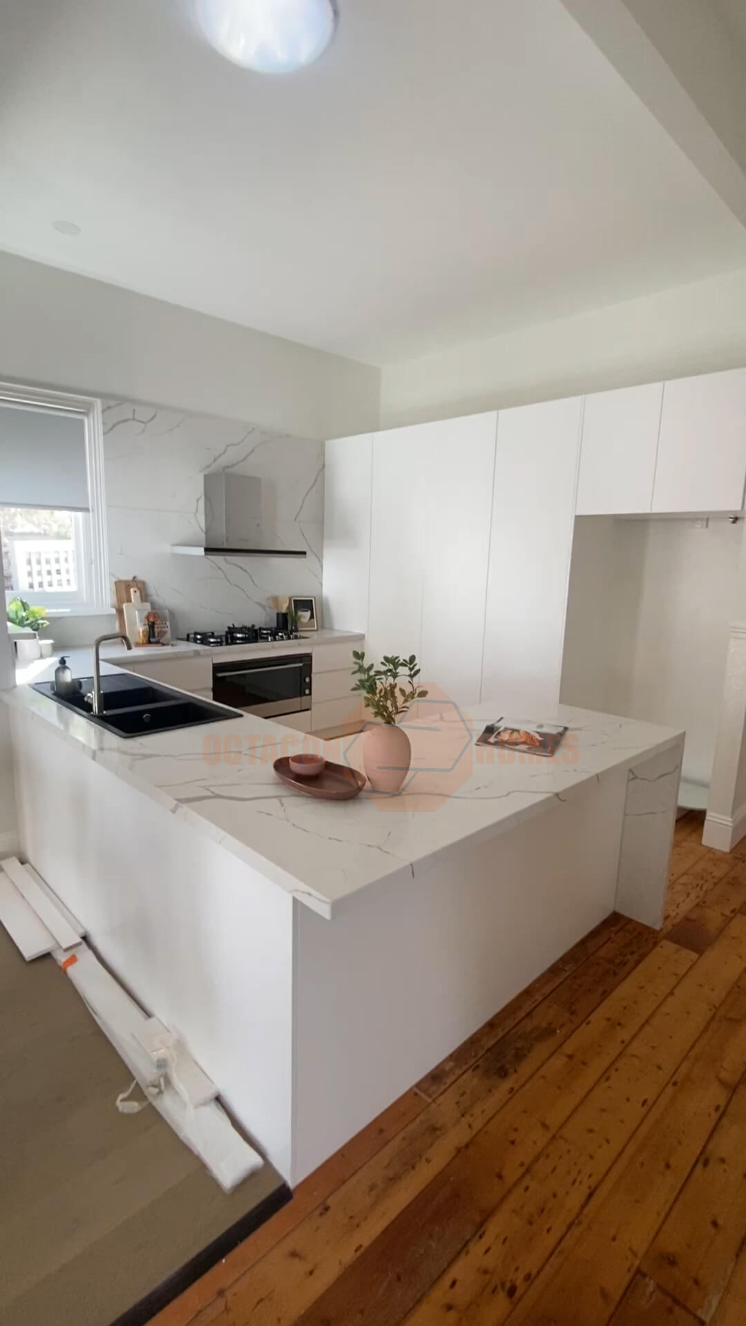 Complete Melbourne kitchen renovation featuring white cabinetry and new flooring